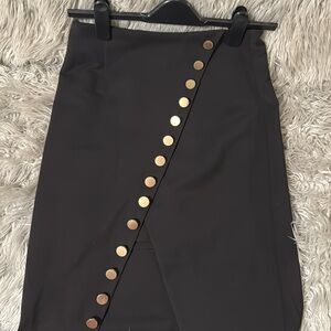 Beautiful black maxi skirt with golden buttons and front slit